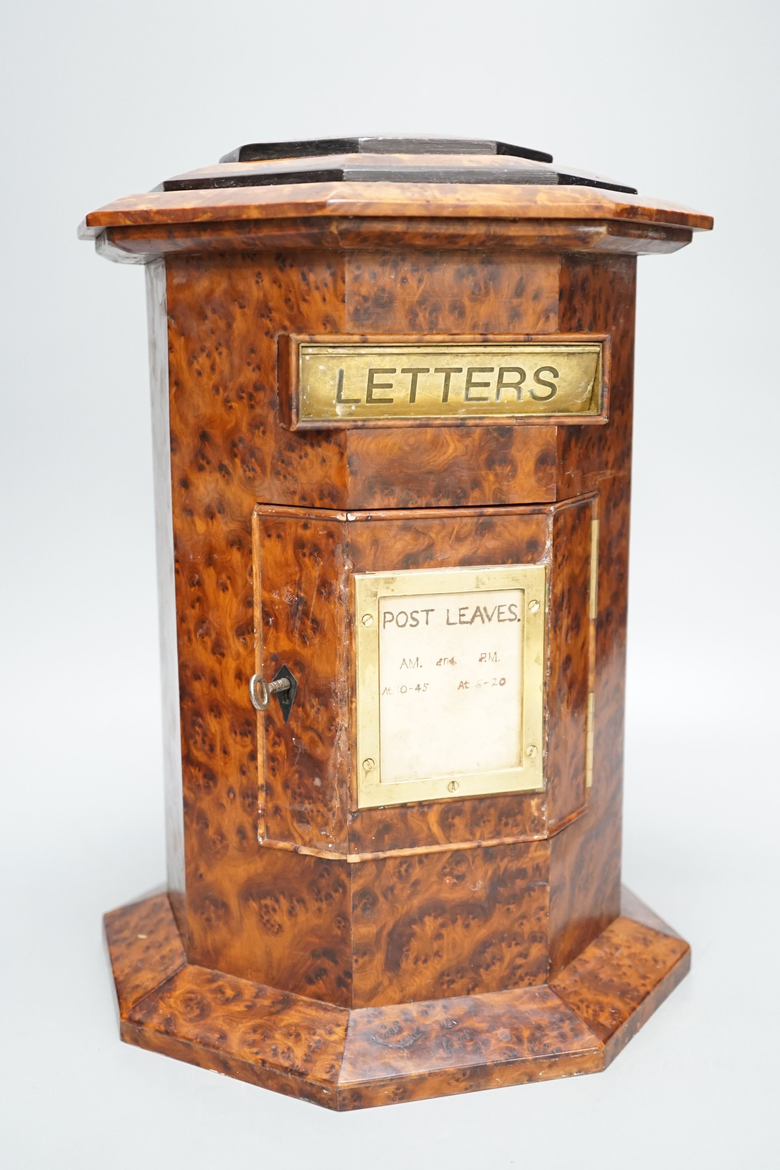 A Victorian-style amboyna octagonal country house post box, 34 cms high.